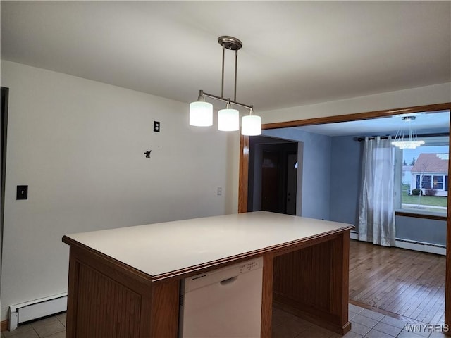 kitchen featuring light countertops, white dishwasher, and a baseboard radiator