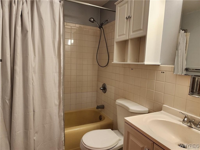 bathroom featuring toilet, tile walls, vanity, and shower / bath combo