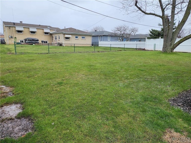 view of yard with a fenced backyard