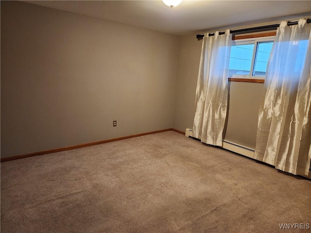 empty room featuring baseboards and carpet flooring