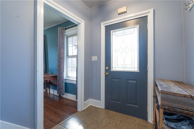 entryway featuring tile patterned floors and baseboards