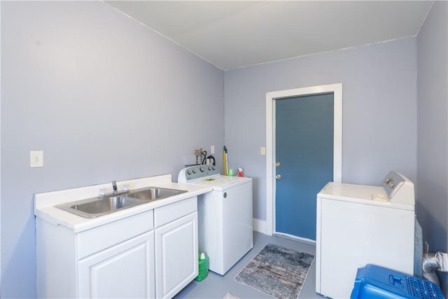 laundry room with a sink, washing machine and dryer, and laundry area