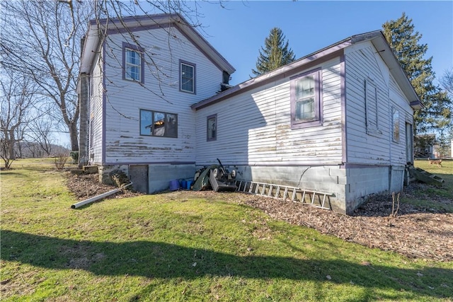 rear view of house with a yard