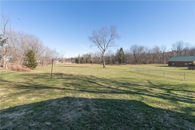 view of yard featuring a rural view and fence