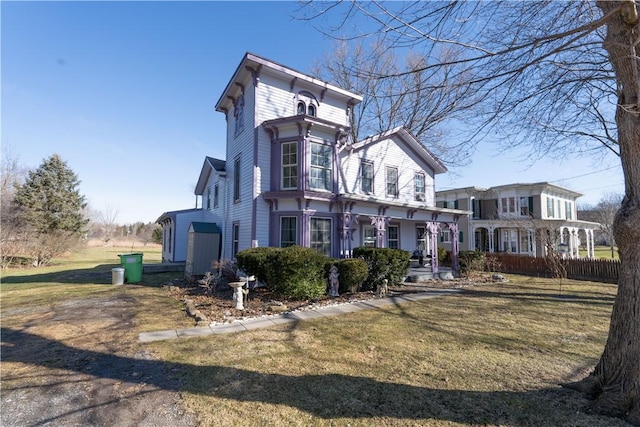 view of front of property with a porch and a front lawn