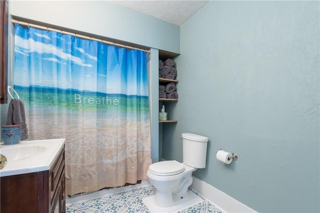 bathroom with vanity, toilet, tile patterned flooring, and a textured ceiling