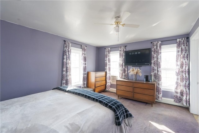 bedroom featuring baseboards, a ceiling fan, and carpet flooring