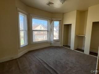 unfurnished bedroom with visible vents