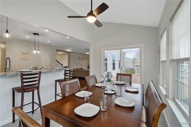 dining area featuring recessed lighting, a ceiling fan, stairs, and vaulted ceiling