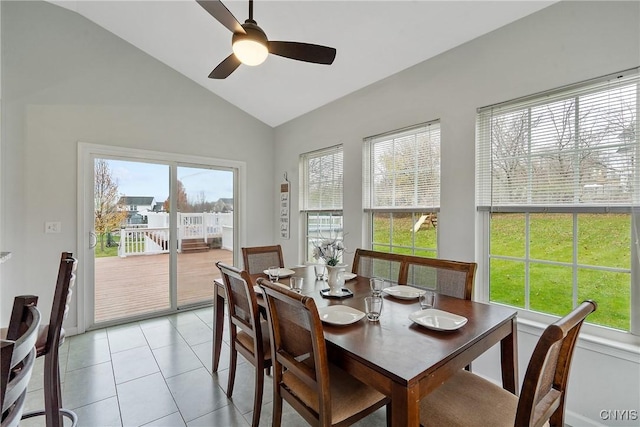 dining area featuring light tile patterned flooring, ceiling fan, and lofted ceiling