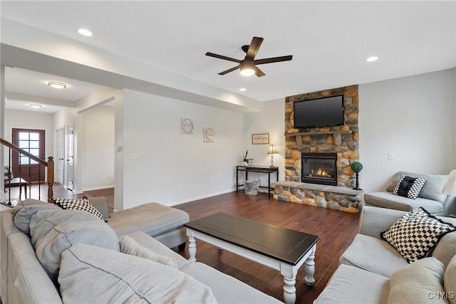 living room with wood finished floors, baseboards, a fireplace, recessed lighting, and ceiling fan