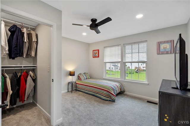 carpeted bedroom featuring recessed lighting, baseboards, visible vents, and a closet