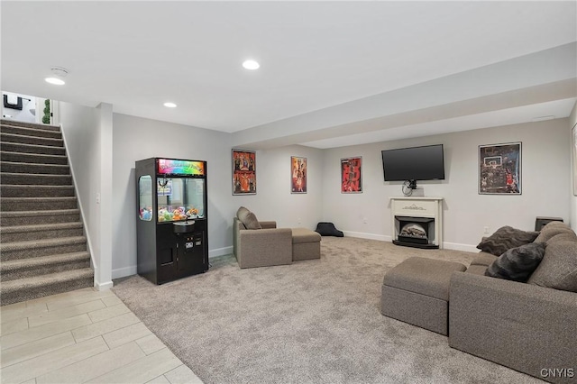 living area with stairs, recessed lighting, a fireplace, and baseboards