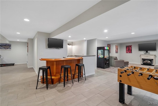 playroom featuring indoor wet bar, recessed lighting, and baseboards