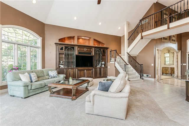 living room featuring visible vents, high vaulted ceiling, recessed lighting, stairs, and tile patterned floors