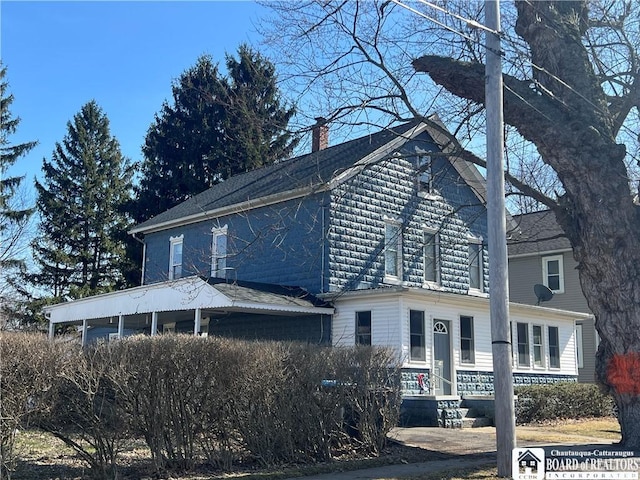 view of property exterior with a chimney