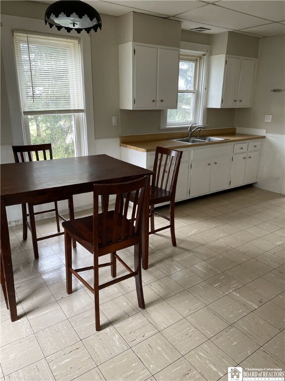 14 Moore Ave, Pomfret, NY 14063 - kitchen with a sink and white cabinetry