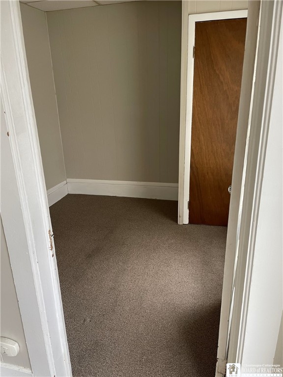 14 Moore Ave, Pomfret, NY 14063 - unfurnished bedroom with carpet flooring and baseboards