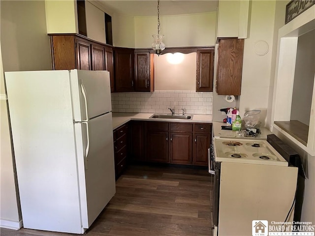 14 Moore Ave, Pomfret, NY 14063 - kitchen featuring white appliances, dark wood-style floors, light countertops, a sink, and backsplash