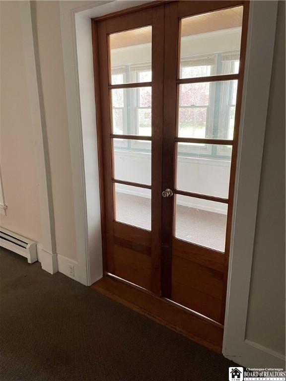 14 Moore Ave, Pomfret, NY 14063 - doorway to outside with baseboard heating, french doors, and dark colored carpet