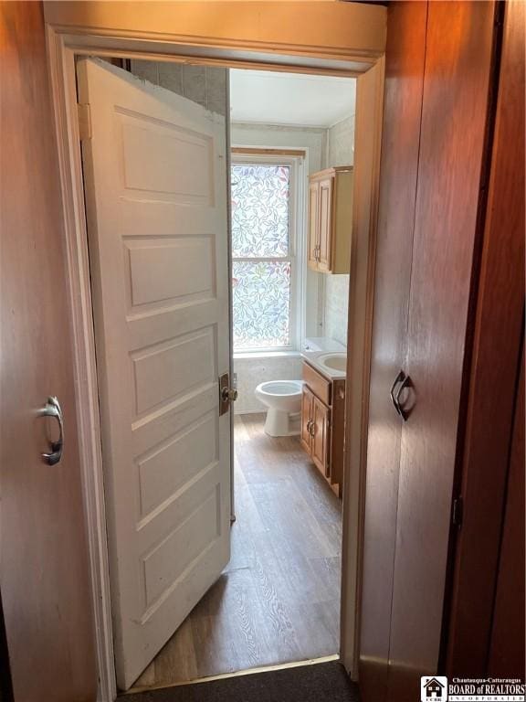 14 Moore Ave, Pomfret, NY 14063 - half bath with toilet, wood finished floors, and vanity