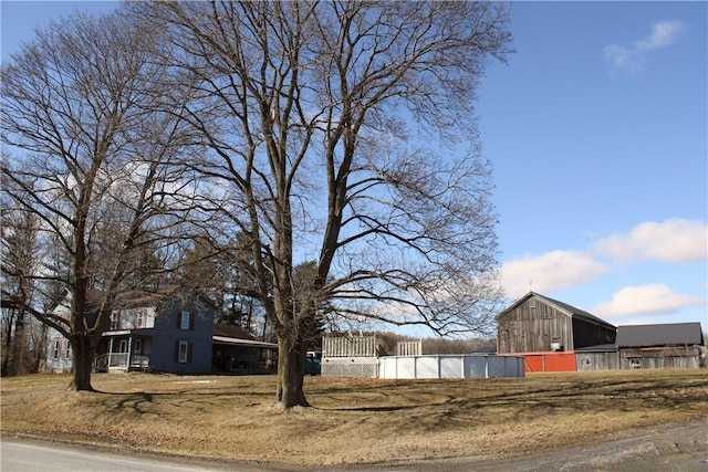 view of yard with a barn and an outdoor structure