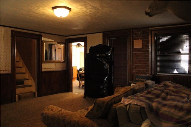 bedroom featuring wallpapered walls and carpet floors