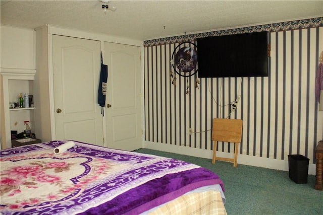 bedroom with a closet, wallpapered walls, and carpet floors