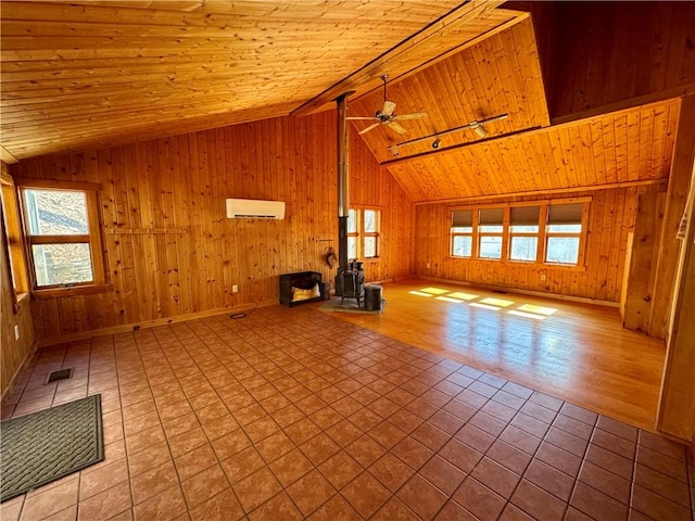 unfurnished living room featuring wood ceiling, visible vents, vaulted ceiling with beams, and a wood stove