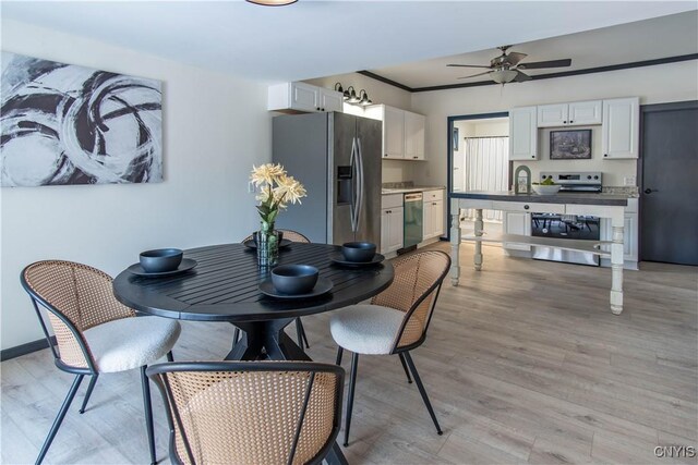 21 Avery Ave, Alexandria, NY 13607 - dining area featuring light wood-type flooring, a ceiling fan, and baseboards