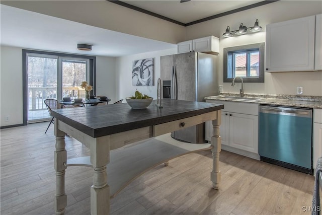 21 Avery Ave, Alexandria, NY 13607 - kitchen with dishwasher, a sink, stainless steel refrigerator with ice dispenser, light wood-style floors, and crown molding