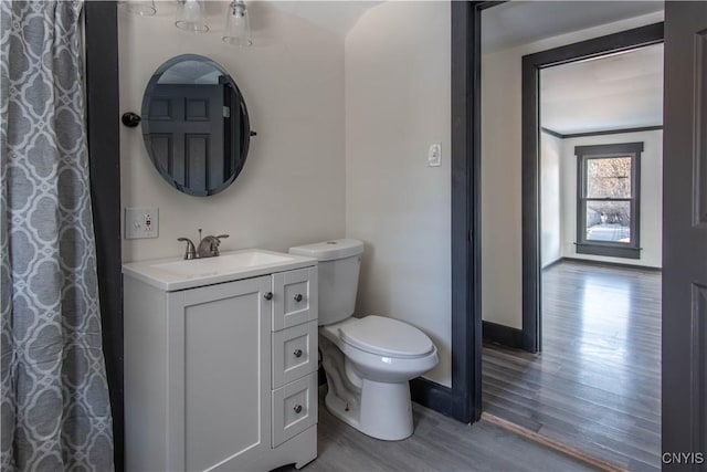 21 Avery Ave, Alexandria, NY 13607 - bathroom with wood finished floors, toilet, vanity, and baseboards