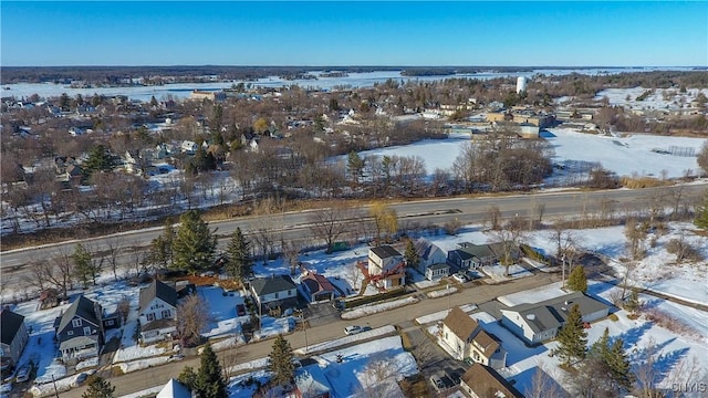 snowy aerial view with a residential view