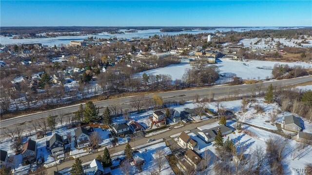 snowy aerial view featuring a residential view