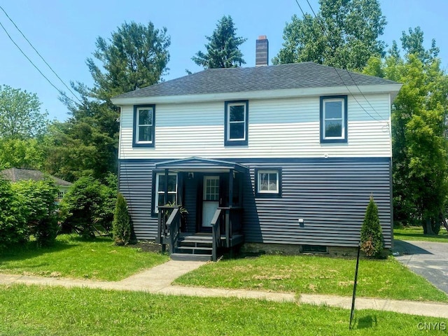 21 Avery Ave, Alexandria, NY 13607 - traditional home featuring a front yard and a chimney
