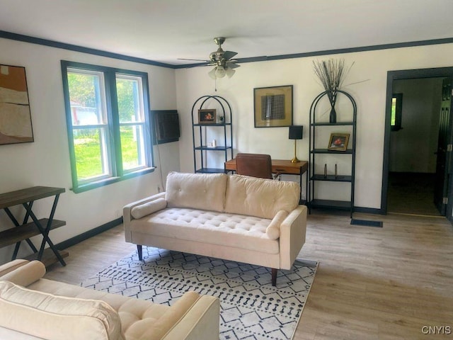 21 Avery Ave, Alexandria, NY 13607 - living room with a ceiling fan, wood finished floors, baseboards, and ornamental molding
