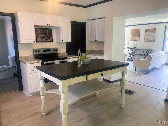21 Avery Ave, Alexandria, NY 13607 - kitchen featuring white cabinetry, light wood-style floors, crown molding, stainless steel range with electric stovetop, and light countertops