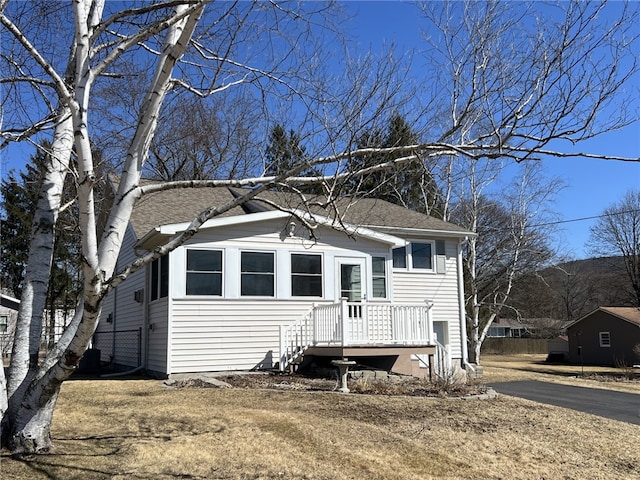 view of front of house with a shingled roof