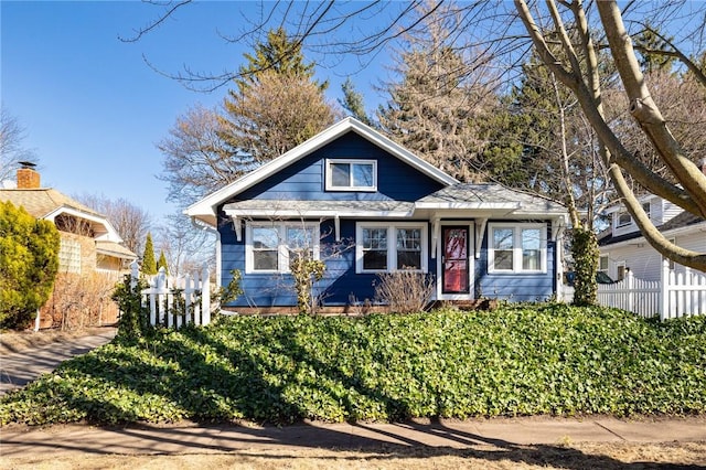 view of front of house featuring fence