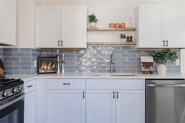 kitchen featuring a sink, light countertops, white cabinets, and stainless steel appliances