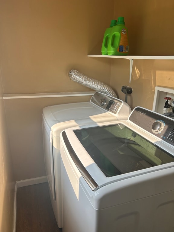 laundry room with laundry area and washing machine and clothes dryer