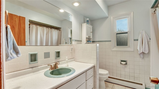 bathroom featuring tile patterned floors, toilet, recessed lighting, baseboard heating, and vanity