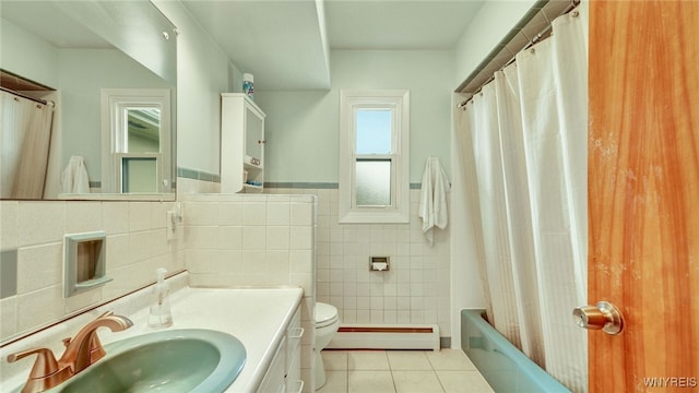 full bath featuring vanity, tile patterned flooring, tile walls, toilet, and baseboard heating