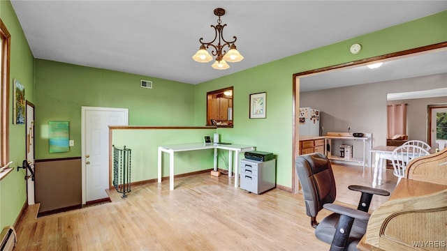 office with visible vents, baseboards, a chandelier, light wood-type flooring, and baseboard heating