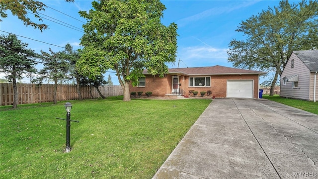 ranch-style house with driveway, fence, a front yard, an attached garage, and brick siding