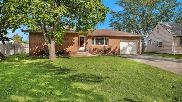 single story home featuring fence, concrete driveway, a front yard, a garage, and brick siding