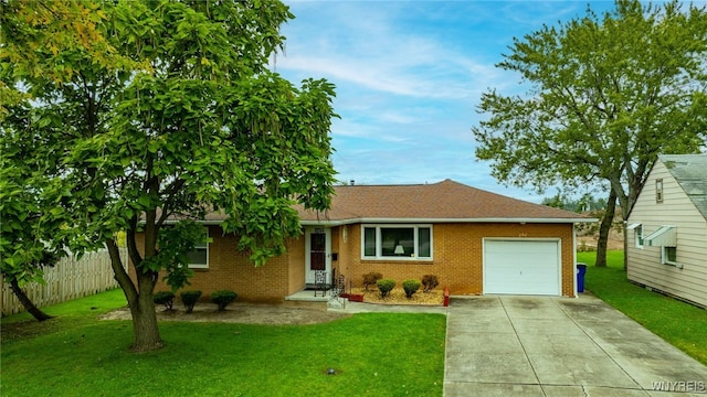 ranch-style house featuring a front yard, a garage, brick siding, and driveway