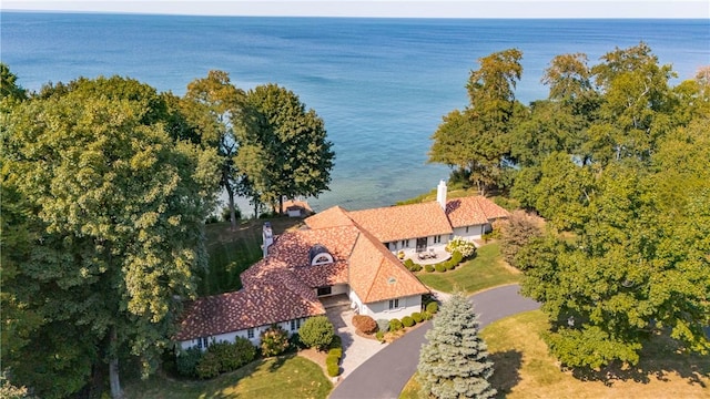 birds eye view of property with a water view