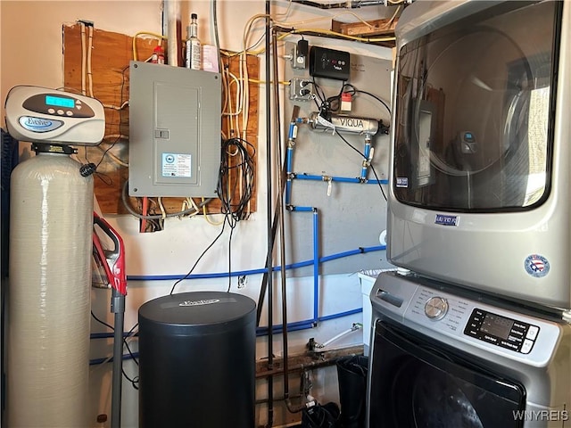 utility room with stacked washer and clothes dryer