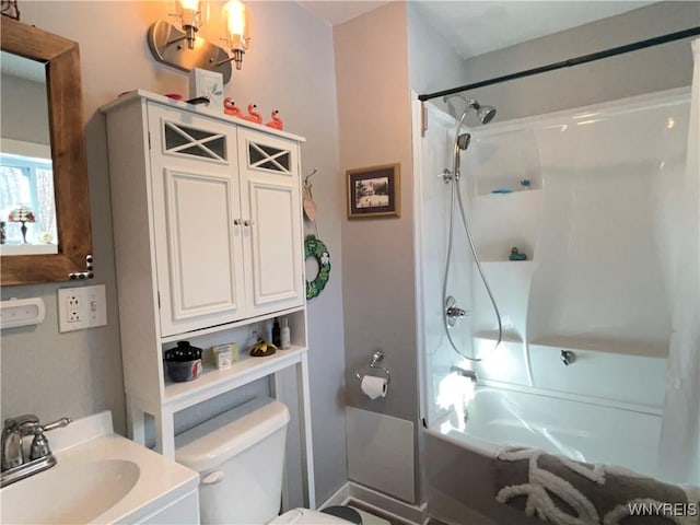 full bath featuring toilet, shower / tub combination, and a sink